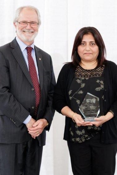 Sumathy Rangarajan receives her award from Dr. Patrick Deane, President, McMaster University.